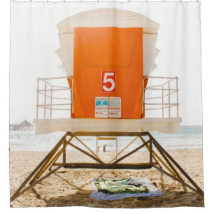 Orange and white shed in front of shore shower curtain
