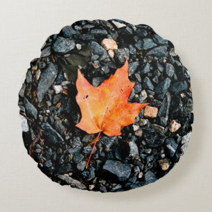 Orange Autumn Leaf on Black Rocks Round Cushion