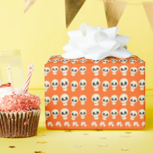 orange background skulls halloween wrapping paper
