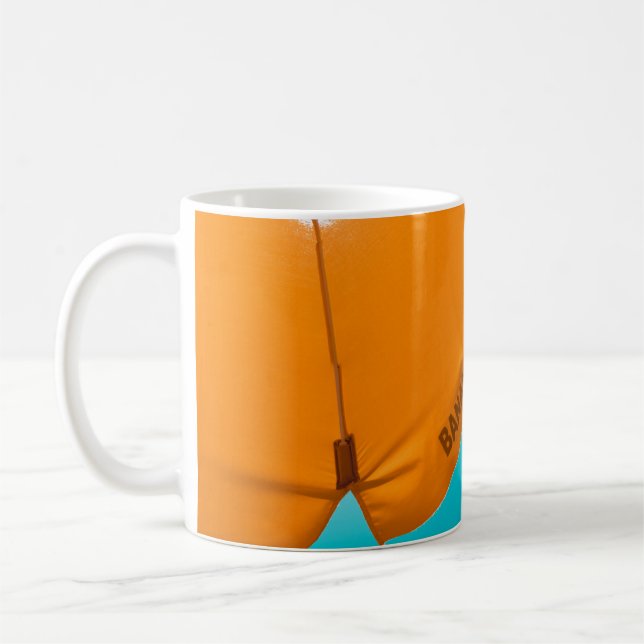 Orange banana beach-printed umbrella coffee mug (Left)