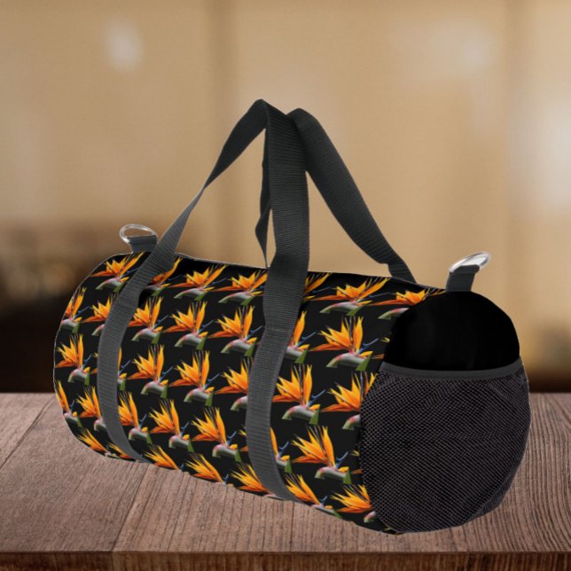 Orange Bird of Paradise Plant Pattern on Black Duffle Bag (In Situ)