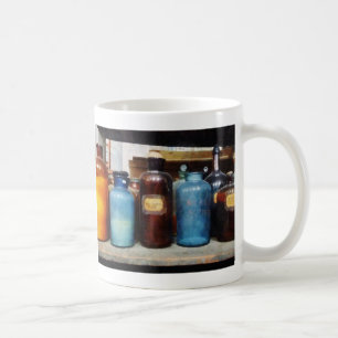Orange, Brown and Blue Bottles of Chemicals Coffee Mug