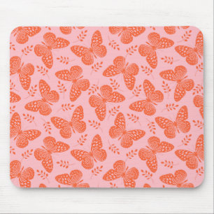 Orange butterfly pattern on pink background mouse mat