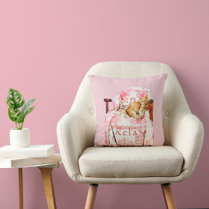 Orange Cat Relaxing on Pink & White Covered Chair Cushion