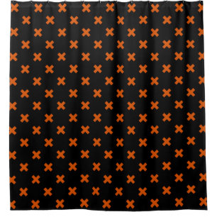 Orange cross stitches on black shower curtain