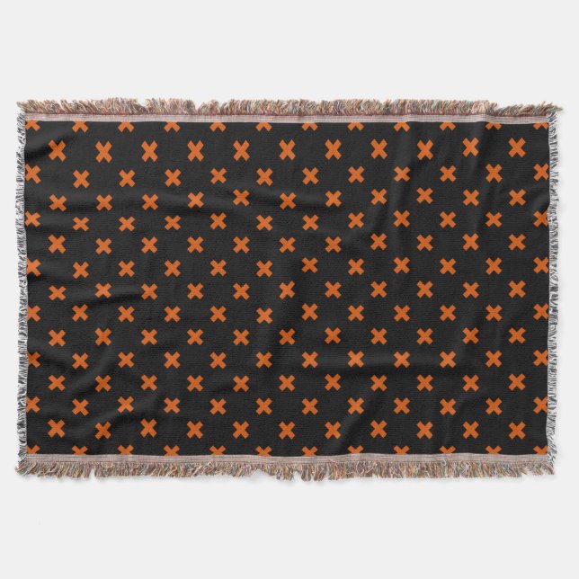 Orange cross stitches on black throw blanket (Front)