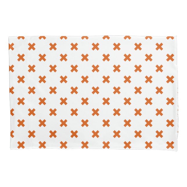 Orange cross stitches on white pillowcase (Front)