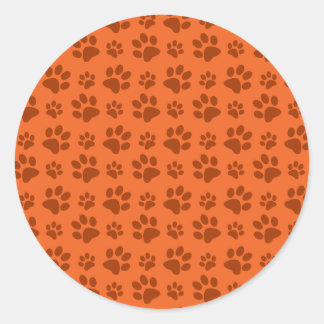 Orange dog paw print pattern classic round sticker