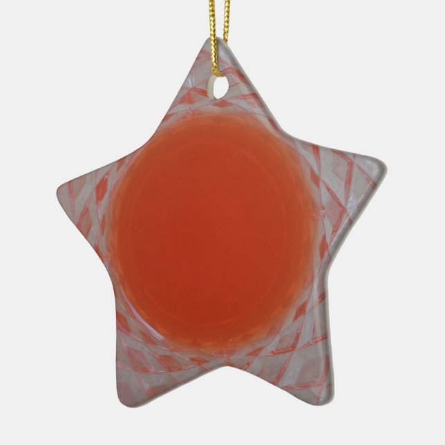Orange drink inside a crystal glass ceramic tree decoration (Left)