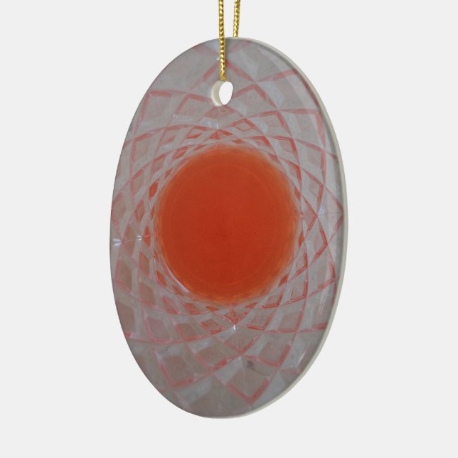 Orange drink inside a crystal glass ceramic tree decoration (Left)