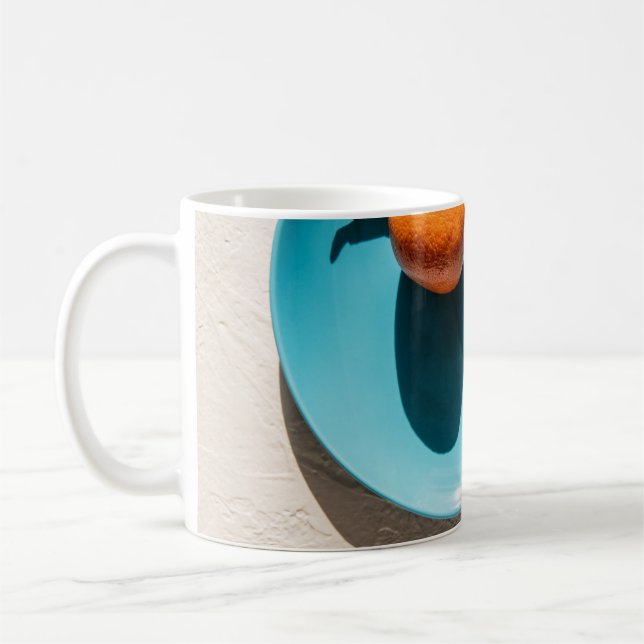 Orange fruit on plate coffee mug (Left)