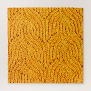 Orange knitted sweater, textured background. jigsaw puzzle