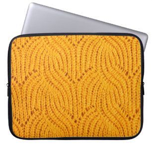 Orange knitted sweater, textured background. laptop sleeve