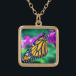 Orange monarch butterfly photo purple flower bold gold plated necklace<br><div class="desc">A close-up photo of a delicate, orange and black monarch butterfly resting on a bright magenta flower. Explore thoughts of warm, sunny days whenever you wear this stunning, colourful photography charm necklace. This necklace comes in small, medium and large sizes, as well as both square and circle shapes. You can...</div>