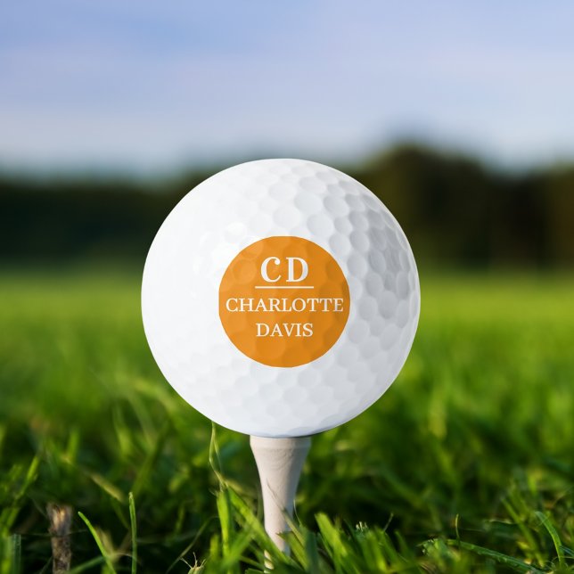 Orange monogrammed name golf balls (Creator Uploaded)