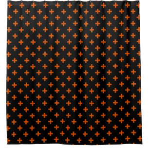 Orange polka crosses on black shower curtain