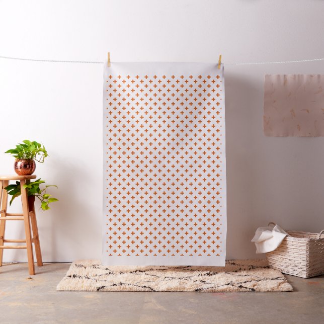 Orange polka crosses on white fabric (In Situ)