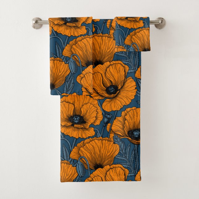 Orange poppies on dark blue bath towel set (Insitu)