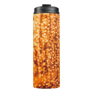 Orange raindrops on glass, abstract background. thermal tumbler