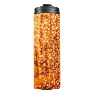 Orange raindrops on glass, abstract background. thermal tumbler