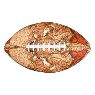 Orange red painted volcanic rock drawing american football
