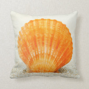 Orange Scallop Shell Standing Upright In Sand Cushion