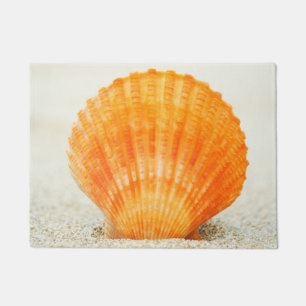 Orange Scallop Shell Standing Upright In Sand Doormat