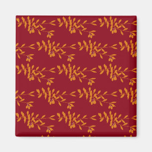 Orange silhouette branch leaves on red magnet