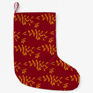 Orange silhouette branch leaves on red small christmas stocking
