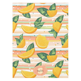 Orange Slice Pattern with Green Leaves on Pastel Tablecloth