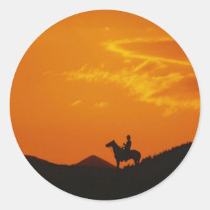 Orange Sunset with Cowboy Silhouette Classic Round Sticker