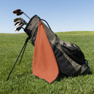 Orange textured surface with swirling pattern golf towel