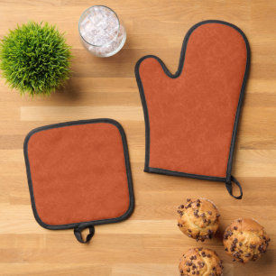 Orange textured surface with swirling pattern oven mitt & pot holder set