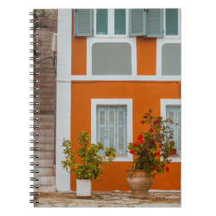 ORANGE WHITE AND GRAY CONCRETE BUILDING NOTEBOOK
