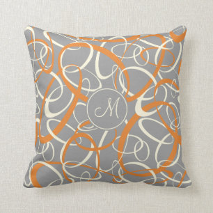 orange white loops on grey geometric pattern cushion