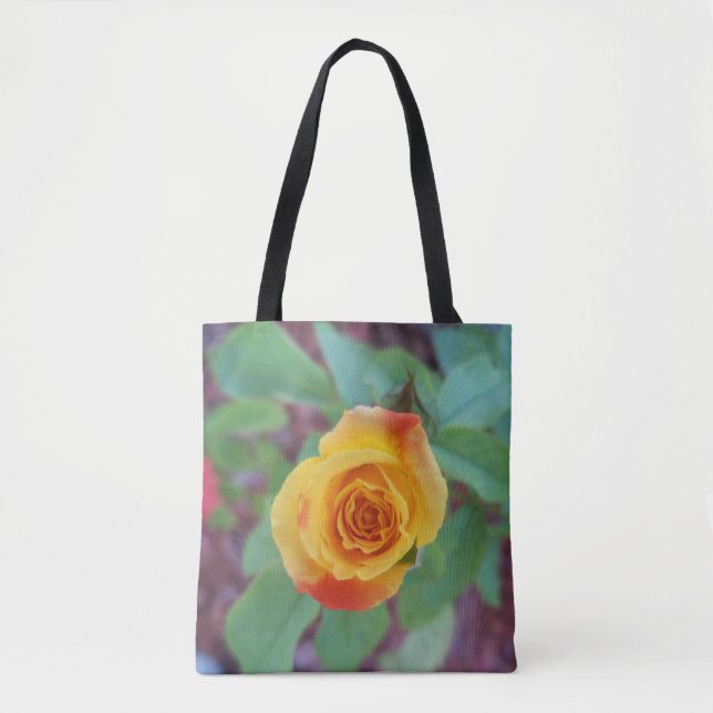 Orange yellow rose with morning dew on a tote bag (Front)