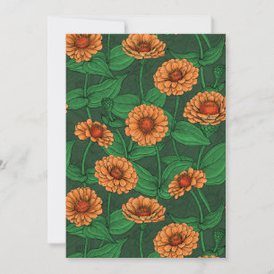 Orange Zinnia flowers, green leaves on dark green