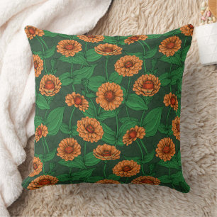 Orange Zinnia flowers, green leaves on dark green Cushion