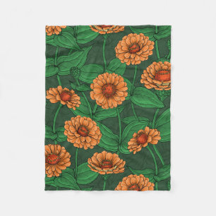Orange Zinnia flowers, green leaves on dark green Fleece Blanket