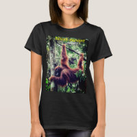 Orangutan hanging in tree