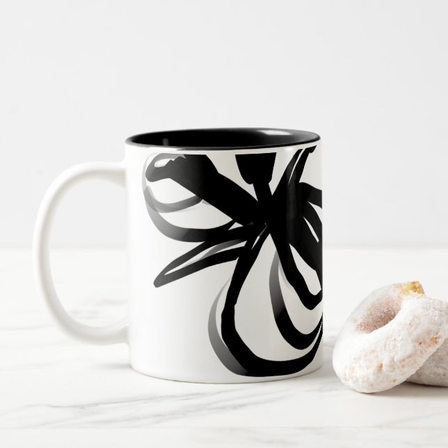 Orchid Blanc: Abstract White & Black Two-Tone Coffee Mug (With Donut)