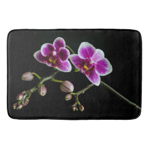 Orchid pink white colour on black pale gentle bath mat