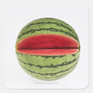 Organic watermelon with a slice cut into it, on square sticker