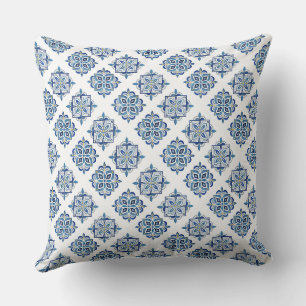 Ornament embroidered blue on white cushion