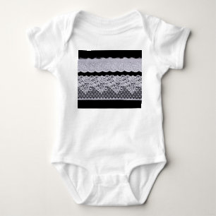 Ornamental white lace, isolated black background. baby bodysuit