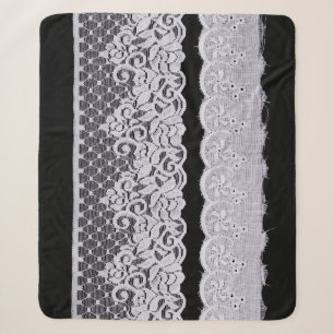 Ornamental white lace, isolated black background. sherpa blanket