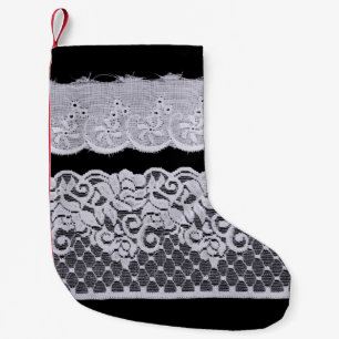 Ornamental white lace, isolated black background. small christmas stocking