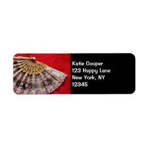 Ornate Hand Held Fan on a Red Background