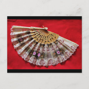 Ornate Hand Held Fan on a Red Background Postcard