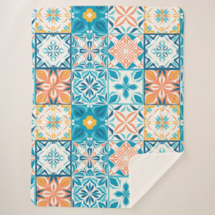 Ornate tiles in blue and orange sherpa blanket
